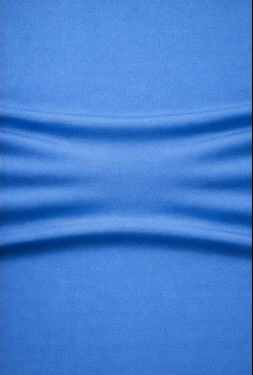Close-up of blue fabric which shows stretch